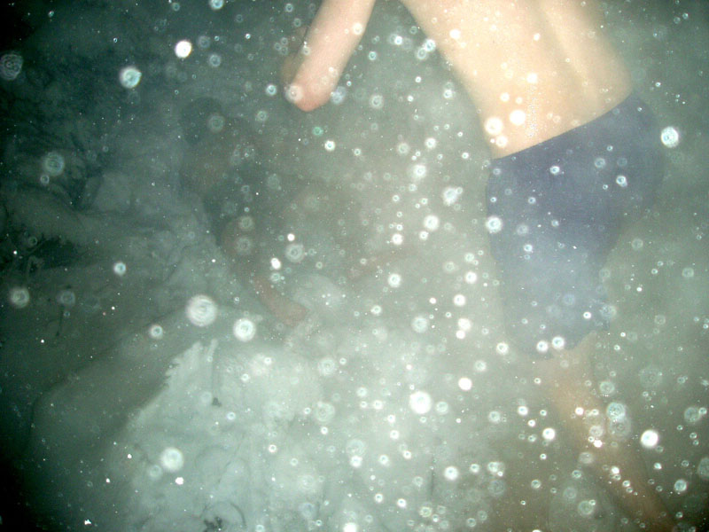 people rolling in the snow